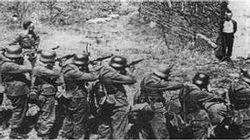 A German firing squad conducts a mock execution in an attempt to get the prisoner to talk.